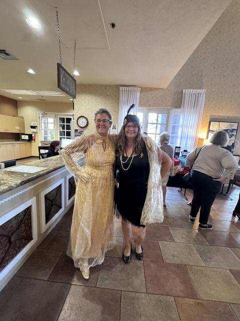 Members in flapper-era gowns at the kickoff social
