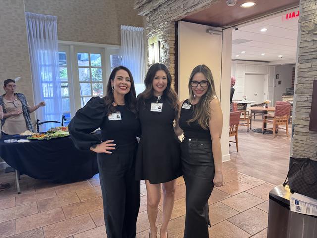 Three members in black, ready for the roaring twenties
