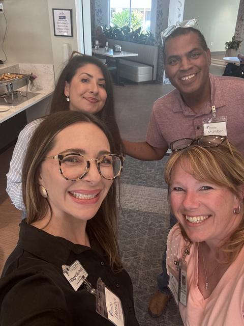 Members smile together before lunch