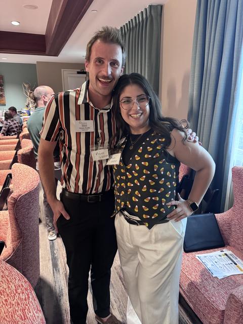 Two members pose together at the October meeting