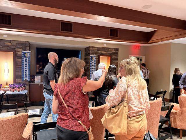 Members mingle after the presentation