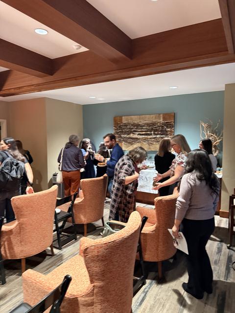 The room fills with conversation between placement professionals